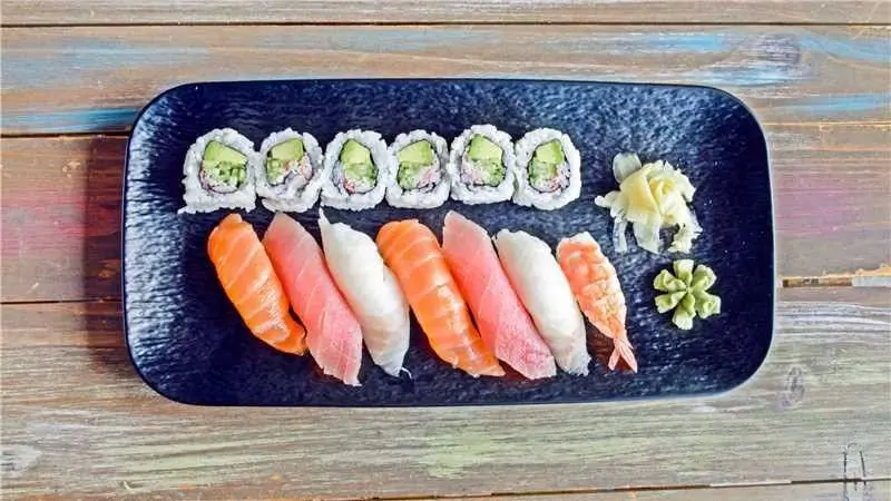 Classic Sushi Assortment - Traditional rolls & sashimi, paired with wasabi/ginger